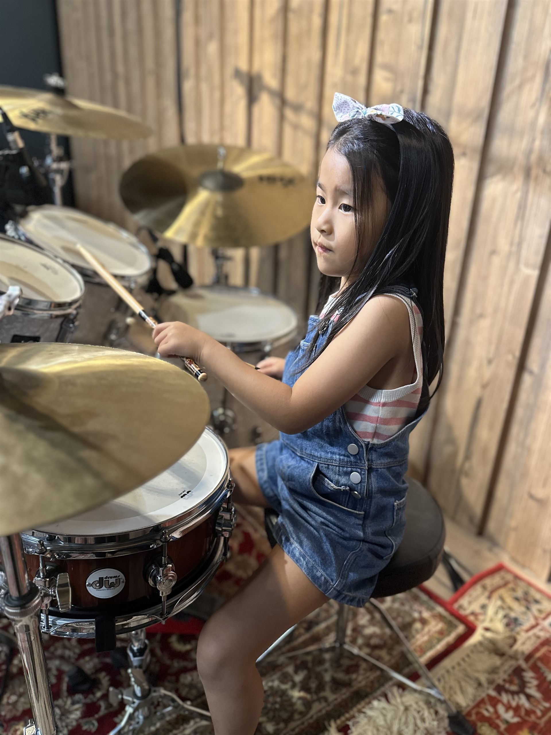 Young student playing a drum kit at a Drum Prodigy lesson