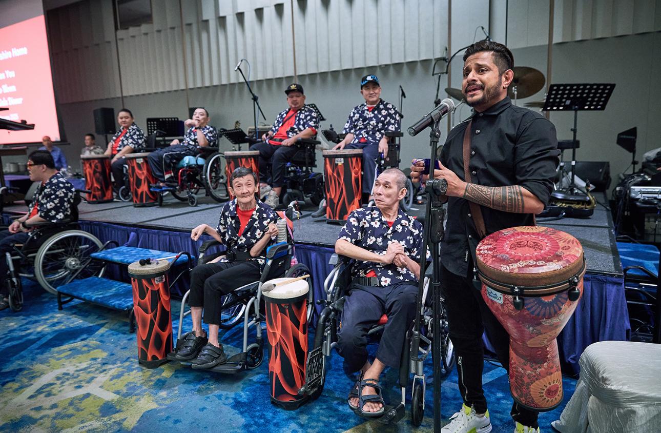 Special needs and seniors drumming together in a Golden Grooves session